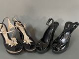 three pairs of black and white shoes with bows on them