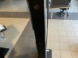 a view of the inside of a store through a glass door