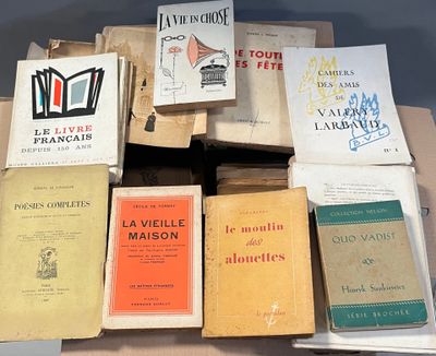 several books are stacked on top of each other on a table