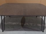 an image of a wooden table with metal legs