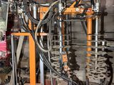 an image of a machine that is working on a piece of machinery