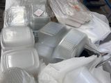 many plastic containers and containers on a table