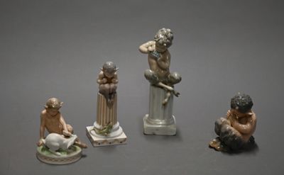 several figurines of different sizes and shapes on a gray surface