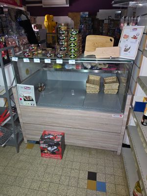 a display case in a store with various items on it