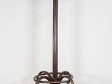 a coat stand with a coat rack on top of it