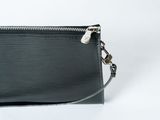 a close up of a black purse on a white background
