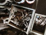 a pile of old tools on the floor next to a pair of scissors and a pair of scissors