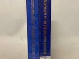 a pair of books sitting on top of each other on a white surface