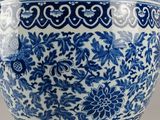 blue and white porcelain bowl with floral designs on it