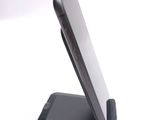 a cell phone that is sitting on top of a stand