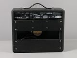 a close up of a guitar amplifier sitting on top of a table