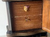 a small wooden box with a drawer on top of it