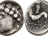 a close up of a coin with a horse on it