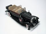 a model of a black car on a white surface