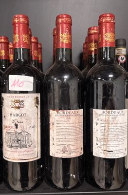 several bottles of wine are lined up on a shelf in a wine cellar