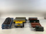 several toy trains are lined up on a white surface