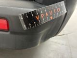 a close up of a car ' s rear bumper with a measuring tape on it