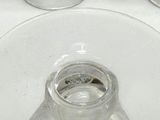 several empty wine glasses sitting on top of a white table