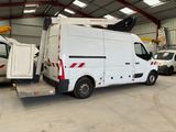 a white van that is parked in a garage