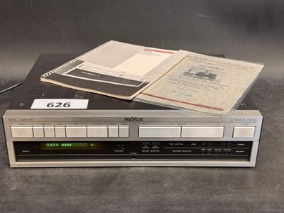 an image of a cassette player sitting on top of a stack of books