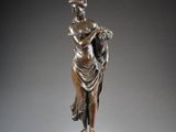 an image of a bronze statue of a woman holding a child