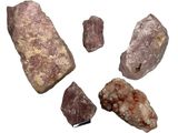 several pieces of rock and stone on a white surface