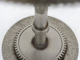 a close up picture of a clock on a table