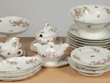 a lot of plates and bowls on the table