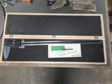 a box with a caliper and a pair of gloves