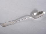 a silver spoon with a spoon handle on a white surface