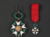 a close up of two medals on a black surface