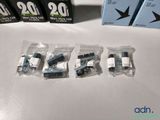 four packages of electronic components sitting on a table