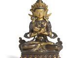 une image représentant une statue d'une personne assise sur un lotus