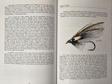 an open book with a drawing of a fly on it