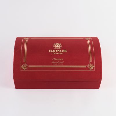 a red box with a gold trim and a name on it