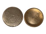 a close up of two metal buttons on a white background