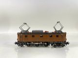 a toy train on a white surface with a white background