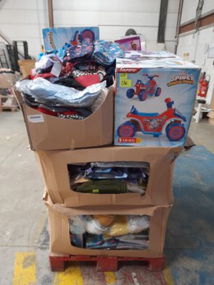 boxes of toys are stacked on top of a cart in a warehouse