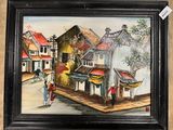 a painting of a street scene in a black frame