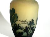 a vase that has a picture of a palm tree on it