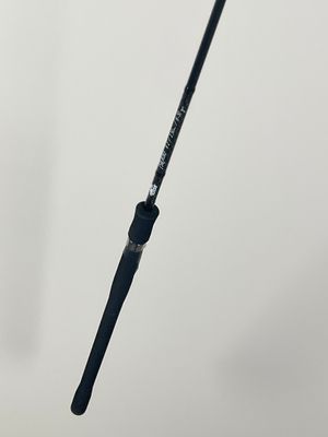 a close up of a fishing rod on a white background