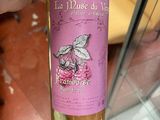 a bottle of wine that is being held by a person