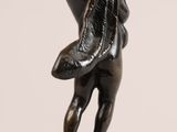 pair of bronze figurines of a boy and a girl