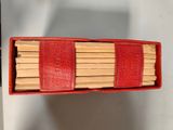a box of matches sticks sitting on top of a table