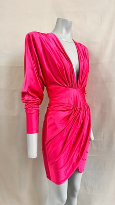 a mannequin dress with a pink wrap around the waist