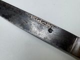 a knife that is sitting on top of a table