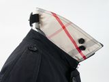 the back of a black jacket with a checkered collar