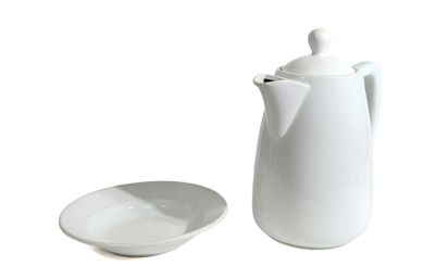 a white coffee pot and a white plate on a white background