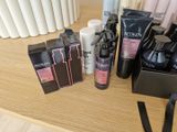 many different types of hair products sitting on a table