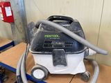 the vacuum is sitting on a cart in the garage